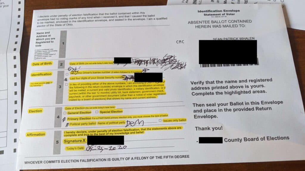 A Picture of a 2020 Ohio absentee ballot envelope. Scribbles and crossed out numbers show my failed attempts to write in the required proof of identity information on the envelope.